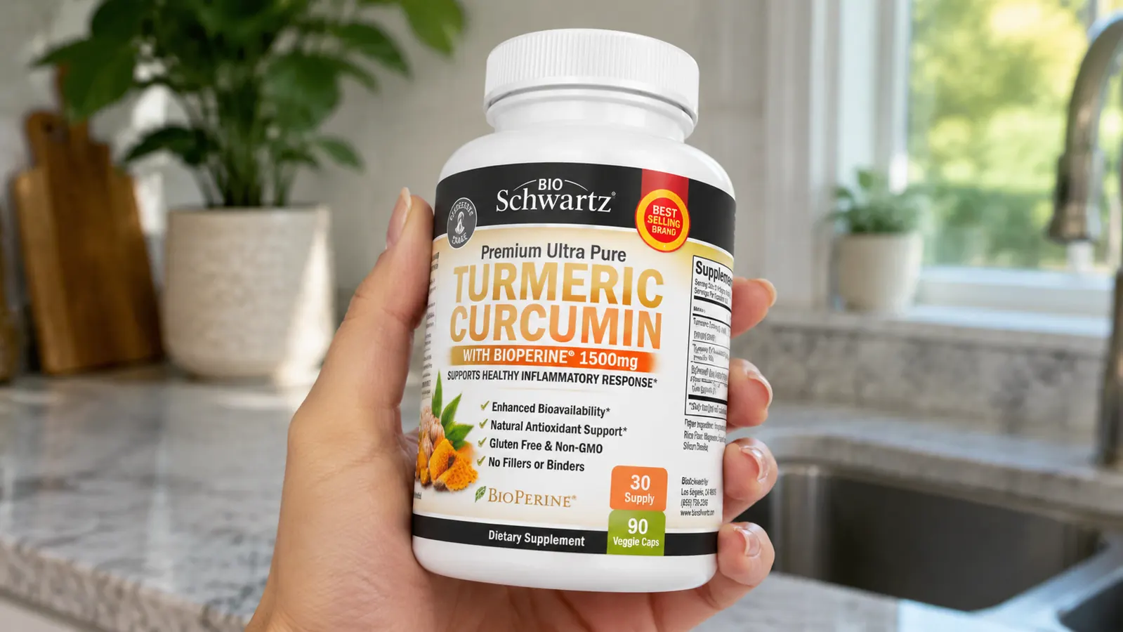 Hand holding a turmeric curcumin capsule bottle with the label facing the camera, supplement facts panel visible